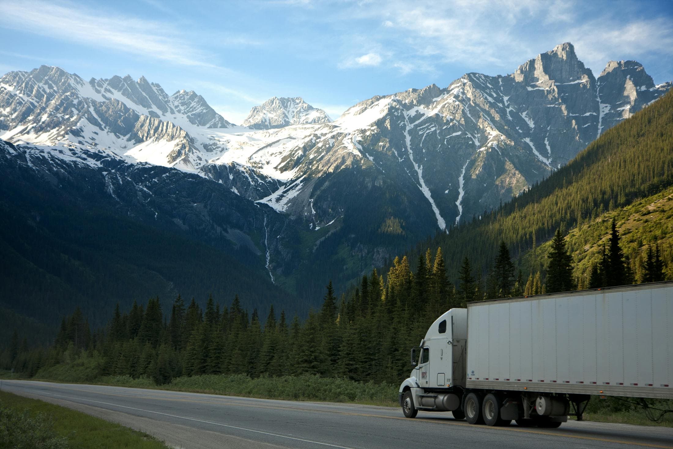 Fleet truck moving through a large quarry site